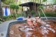 A group of women in bikinis sitting in a hot tub.