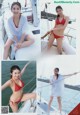 A woman in a red bikini sitting on a boat.